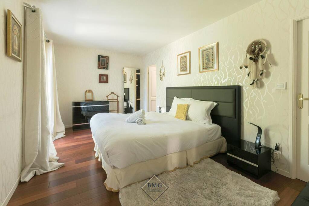 Posteľ alebo postele v izbe v ubytovaní Golf House Disneyland BMYGUEST