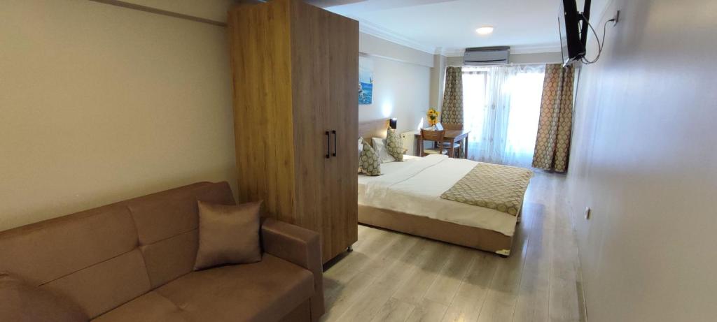 A bed or beds in a room at Ortaköy Suites Hotel