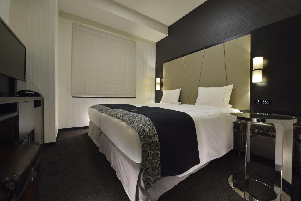 Postel nebo postele na pokoji v ubytování The Royal Park Hotel Tokyo Haneda Airport Terminal 3