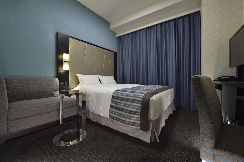 Postel nebo postele na pokoji v ubytování The Royal Park Hotel Tokyo Haneda Airport Terminal 3