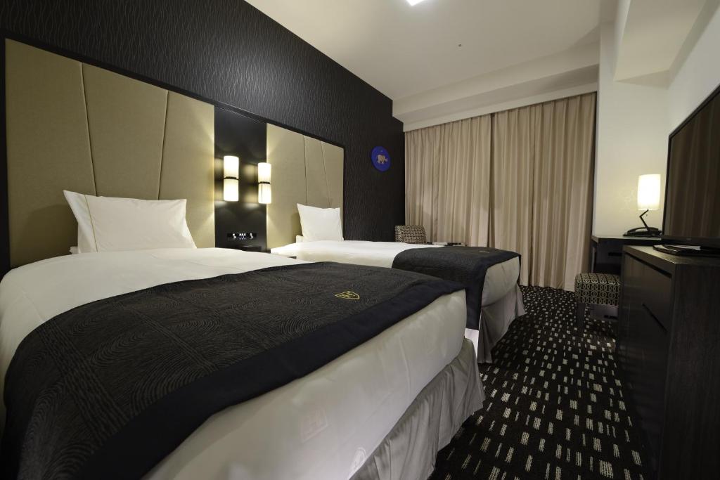 Postel nebo postele na pokoji v ubytování The Royal Park Hotel Tokyo Haneda Airport Terminal 3