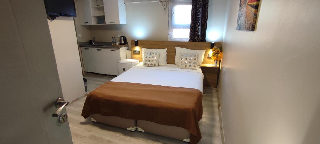 A bed or beds in a room at Ortaköy Suites Hotel