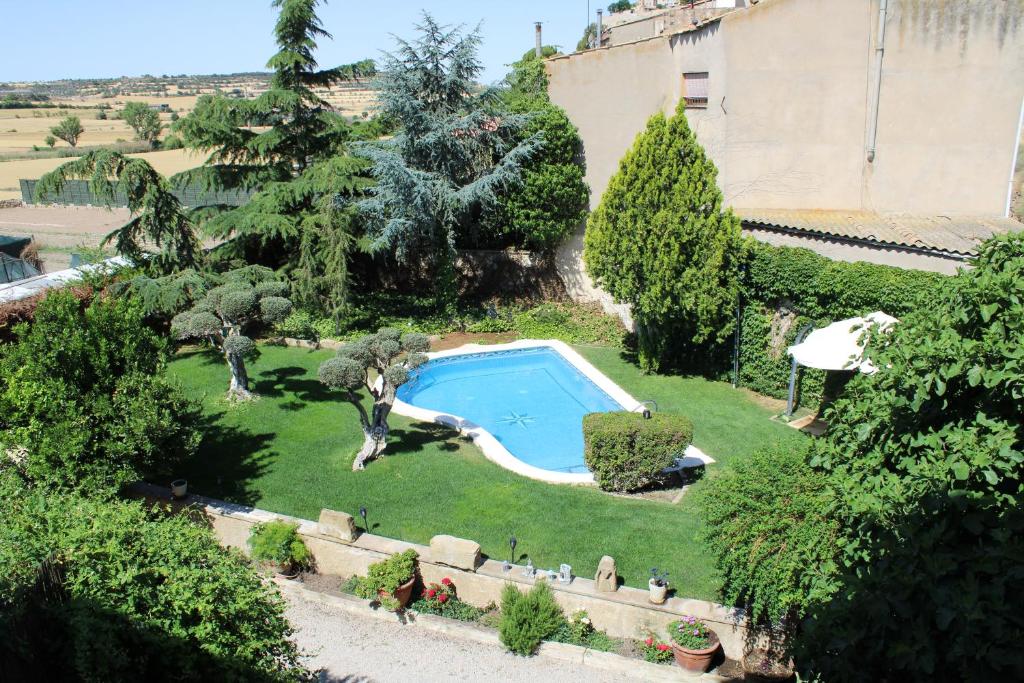 an overhead view of a garden with a swimming pool at HOSTAL LA SAVINA in Cervera