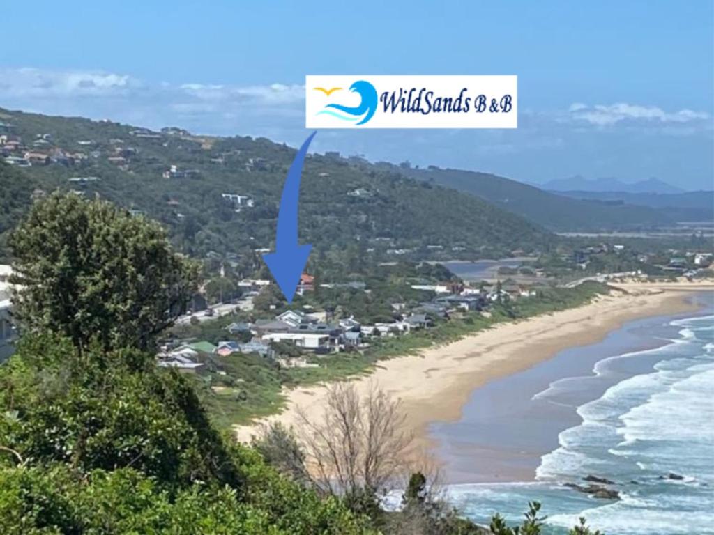 a view of a beach with the words wild islands scsi at Wildsands Bed & Breakfast in Wilderness