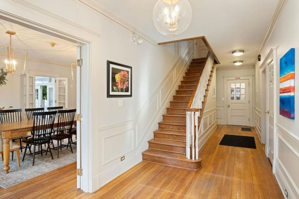 a staircase in a home with a dining room at Kersey Coates at Southmoreland on the Plaza in Kansas City