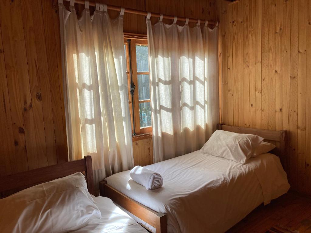 Postel nebo postele na pokoji v ubytování Green Baker Lodge