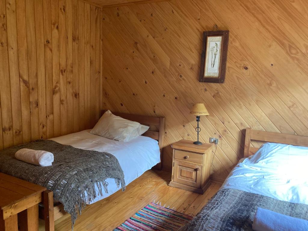 Postel nebo postele na pokoji v ubytování Green Baker Lodge