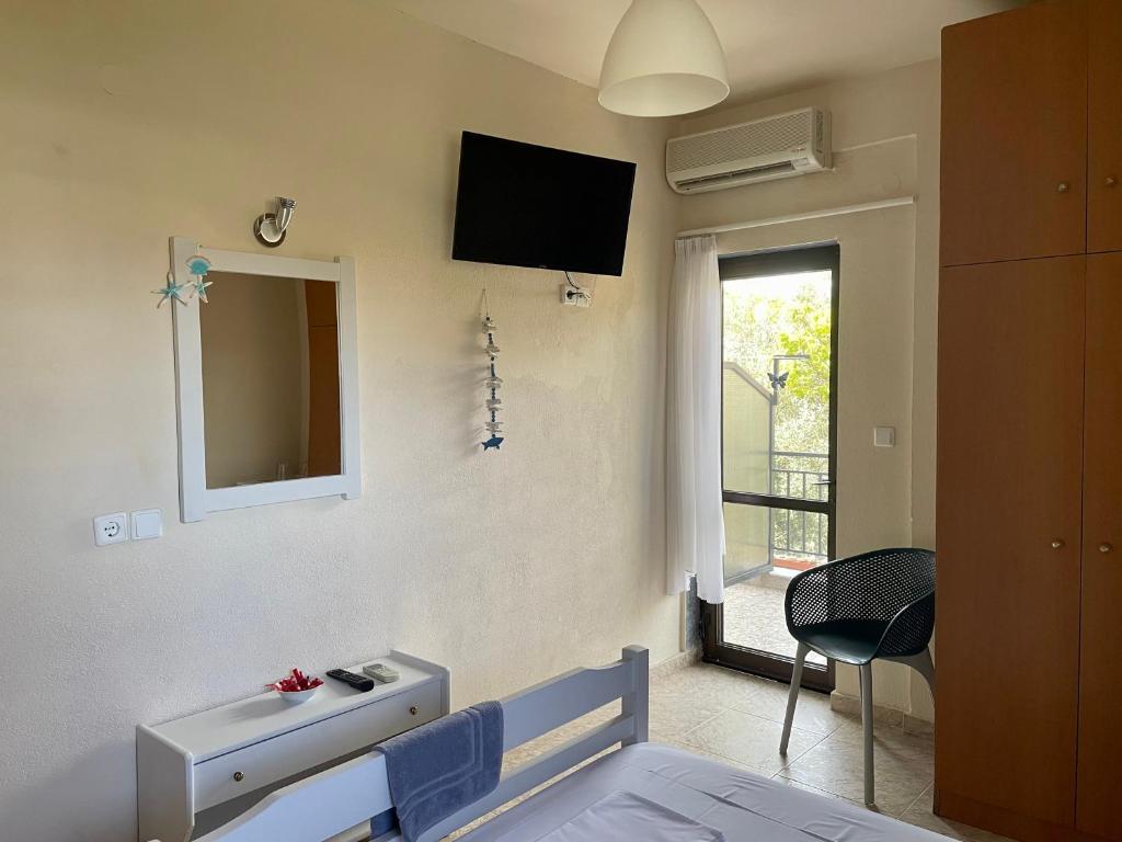 TV a/nebo společenská místnost v ubytování Hotel Argilos
