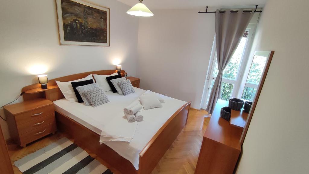 Posteľ alebo postele v izbe v ubytovaní Deluxe Apartman Pervan