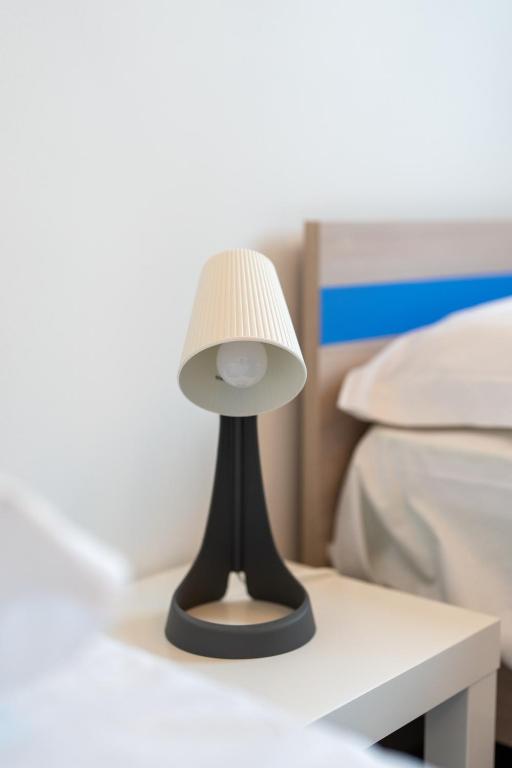 Letto o letti in una camera di Cortile dei Giusti - Combo Guesthouse