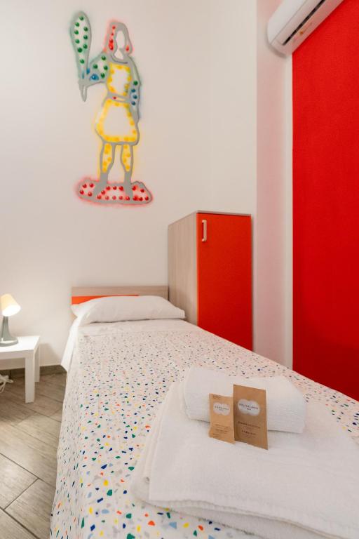Letto o letti in una camera di Cortile dei Giusti - Combo Guesthouse