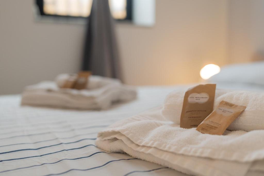 Letto o letti in una camera di Cortile dei Giusti - Combo Guesthouse
