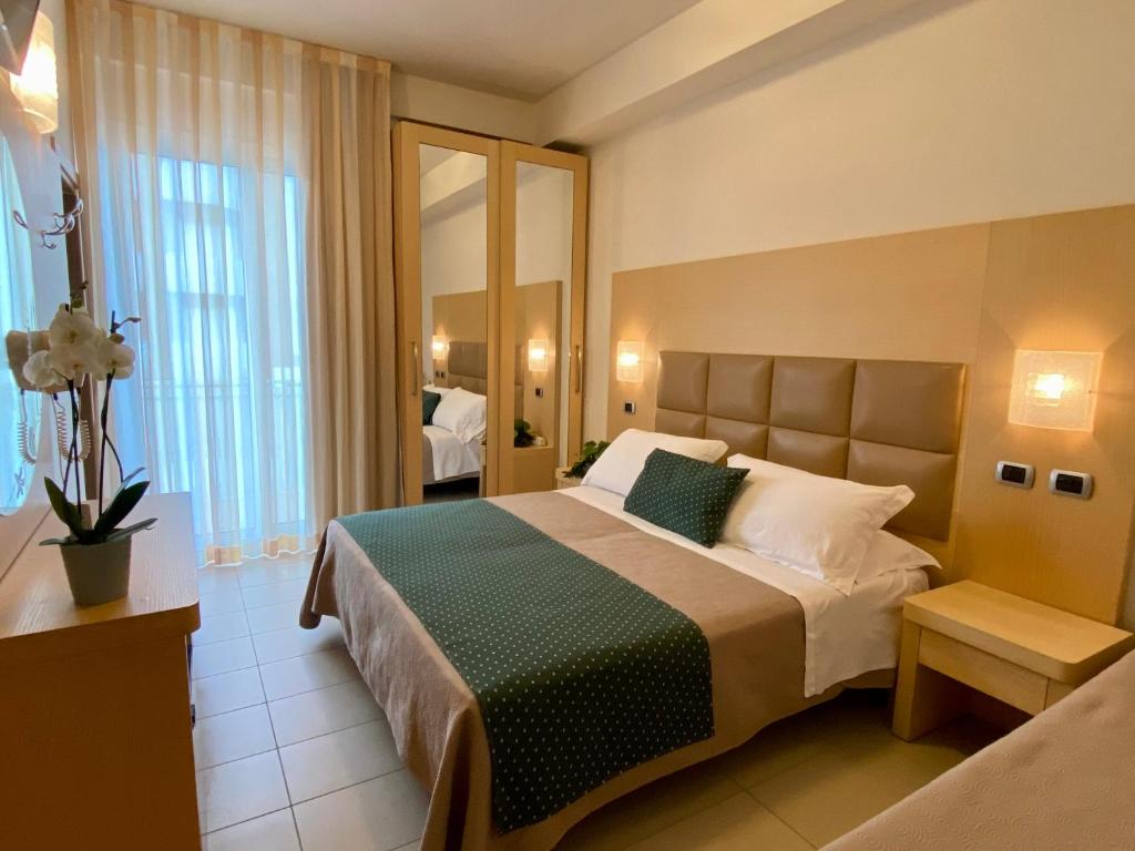 Postel nebo postele na pokoji v ubytování Hotel Granada
