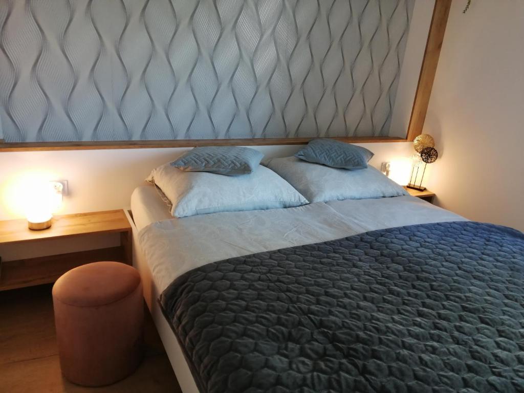 Postel nebo postele na pokoji v ubytování Apartament Zielone Wzgórze 2