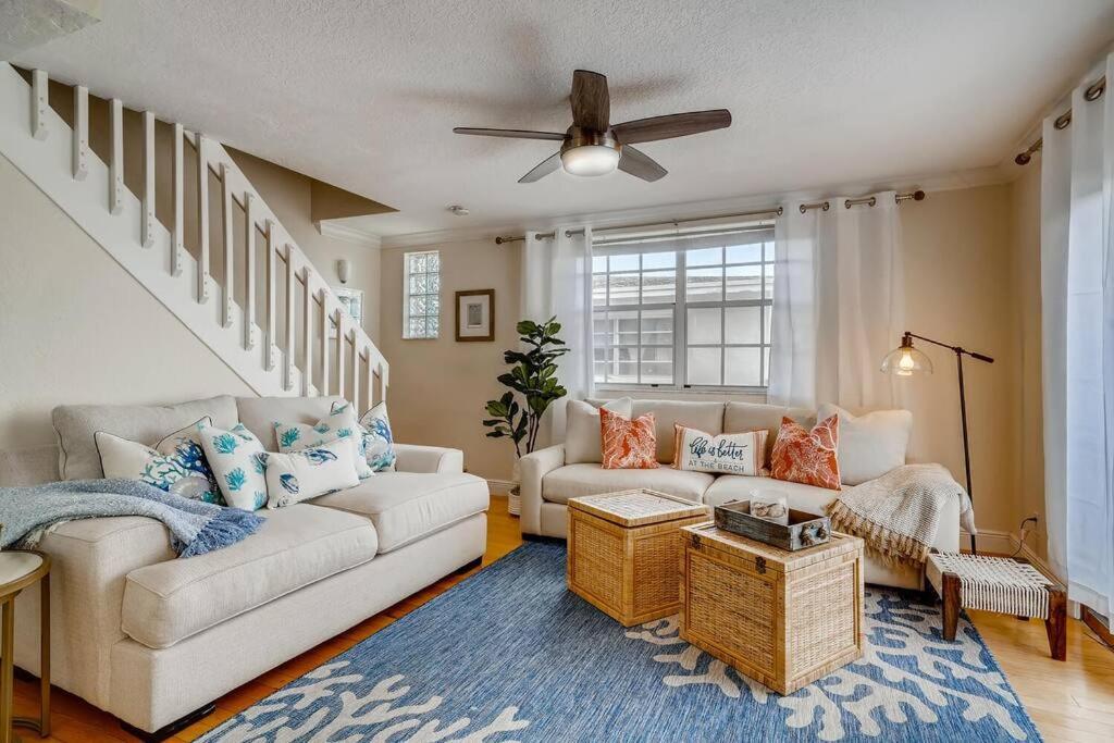a living room with a couch and a ceiling fan at Beach 2 level spacious condo in Fort Lauderdale