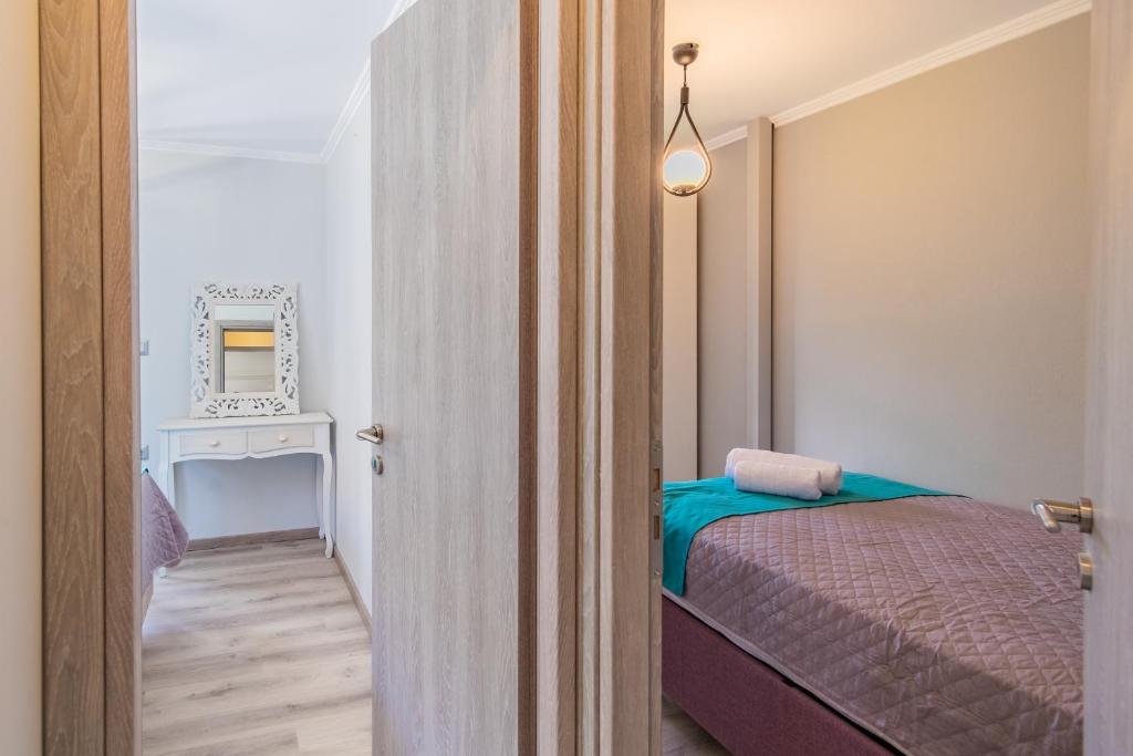 Postel nebo postele na pokoji v ubytování Dion apartment