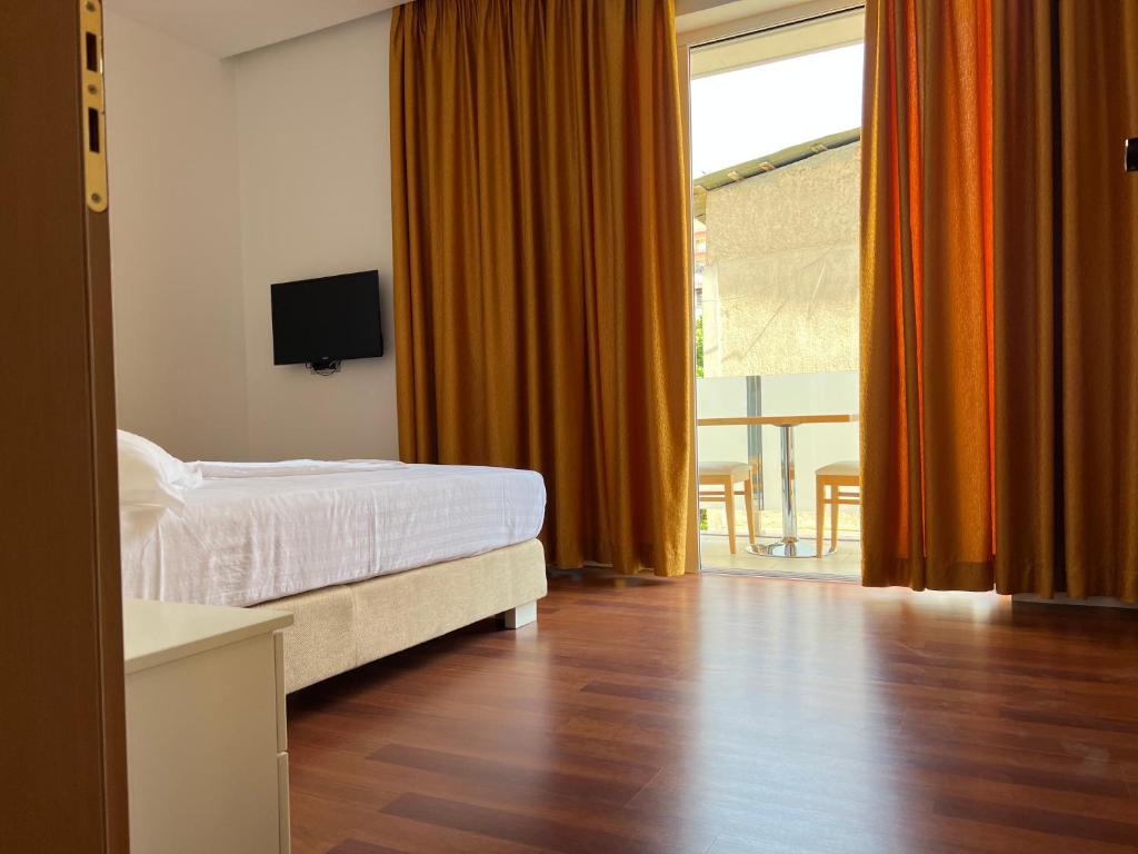 Postel nebo postele na pokoji v ubytování 3B Suites Boutique Hotel