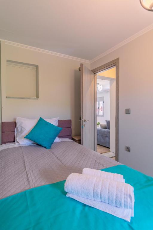 Postel nebo postele na pokoji v ubytování Dion apartment