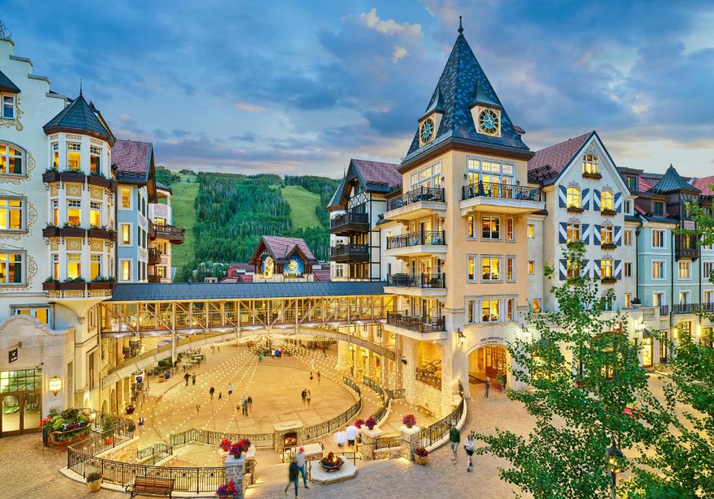 a group of buildings with a plaza in front of it at The Arrabelle at Vail Square, a RockResort in Vail