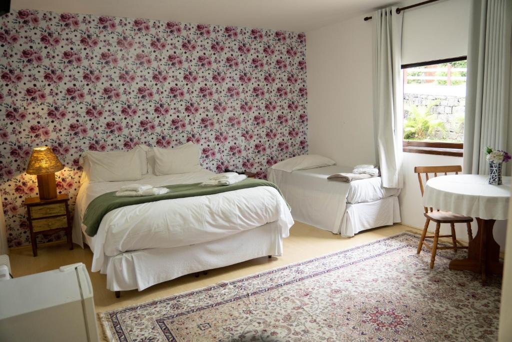 Postel nebo postele na pokoji v ubytování Hotel Ascona