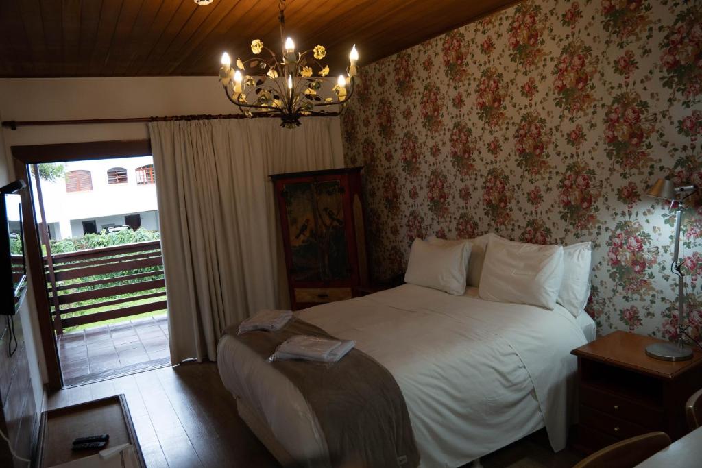 Postel nebo postele na pokoji v ubytování Hotel Ascona