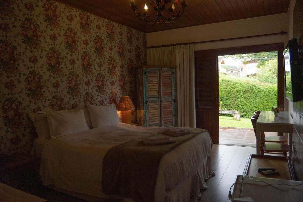 Postel nebo postele na pokoji v ubytování Hotel Ascona