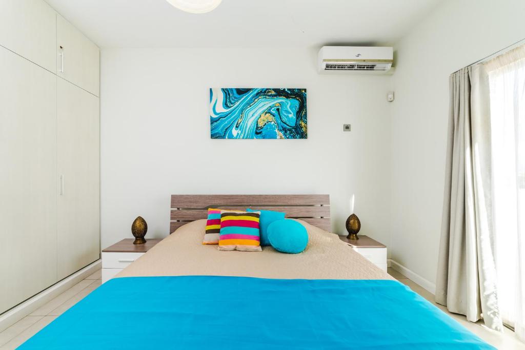 Postel nebo postele na pokoji v ubytování Beachcove Apartment 9 in Pereybere