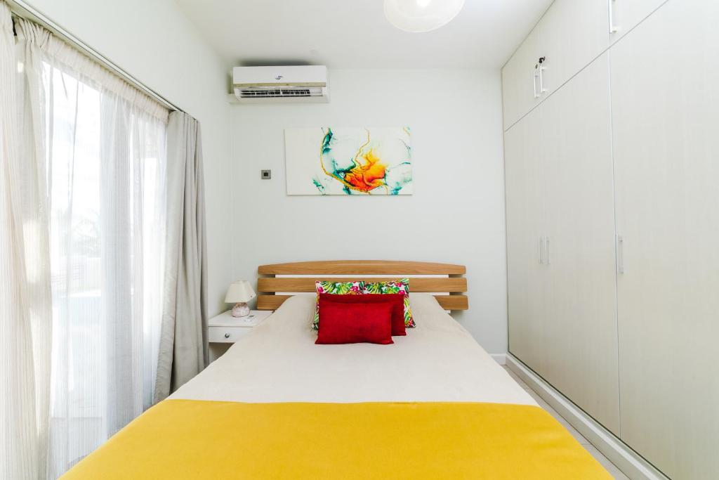 Postel nebo postele na pokoji v ubytování Beachcove Apartment 9 in Pereybere