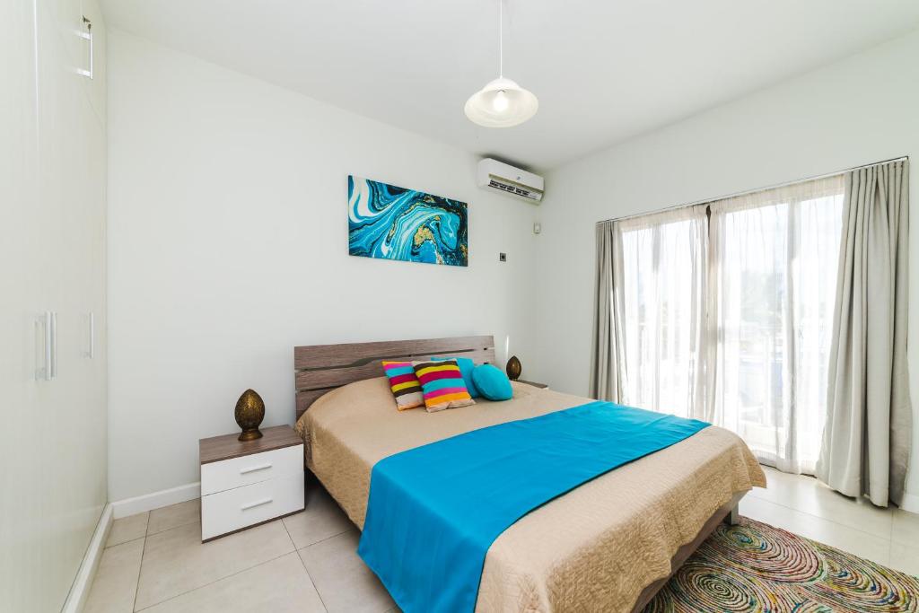 Postel nebo postele na pokoji v ubytování Beachcove Apartment 9 in Pereybere