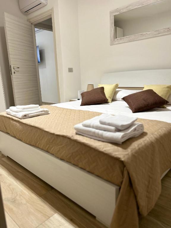 A bed or beds in a room at NEWHOUSE ROOFTOP - Super Penthouse Seaview