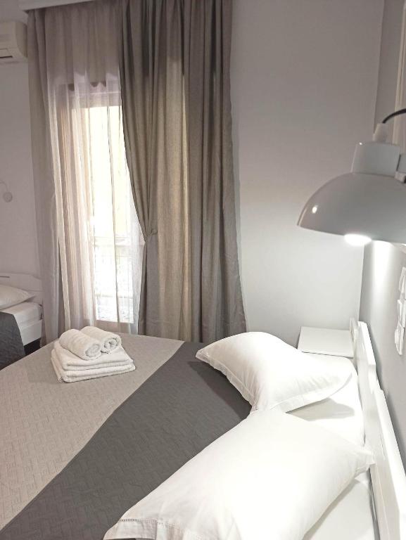 Postel nebo postele na pokoji v ubytování Apartments Papadioti