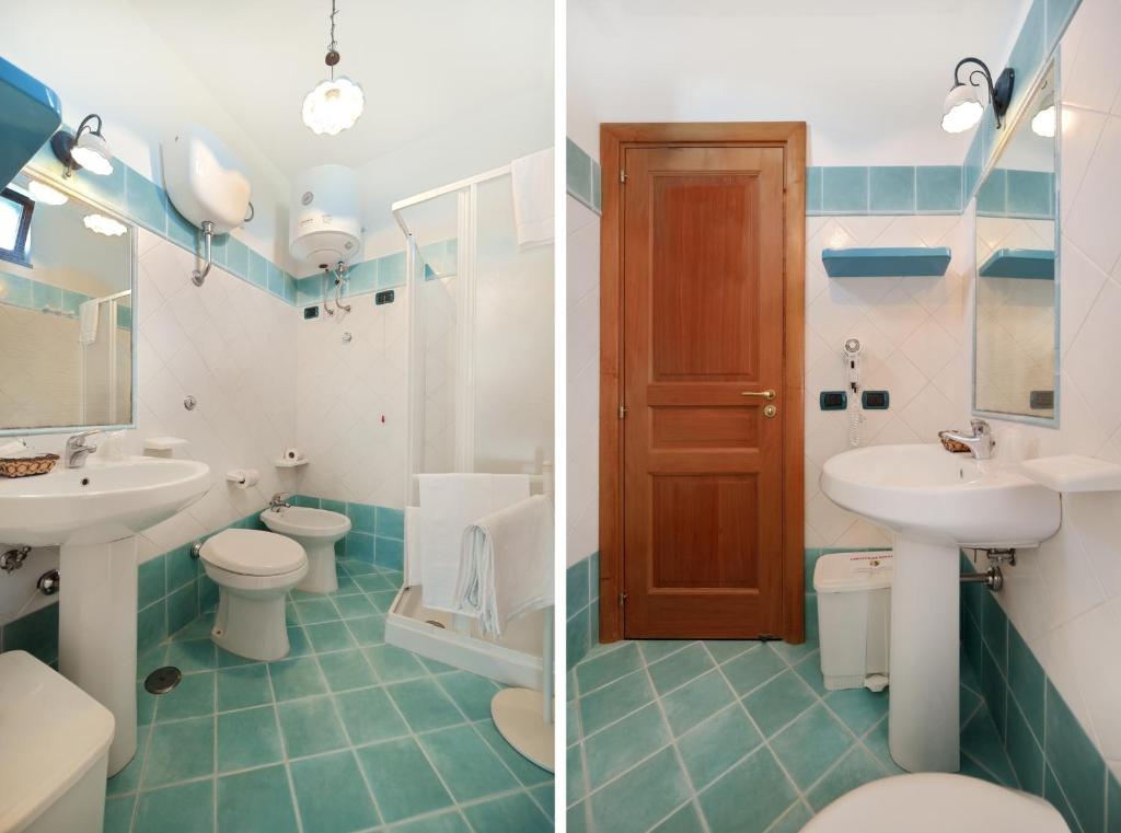 a bathroom with two sinks and two toilets at La Capannina in Procida