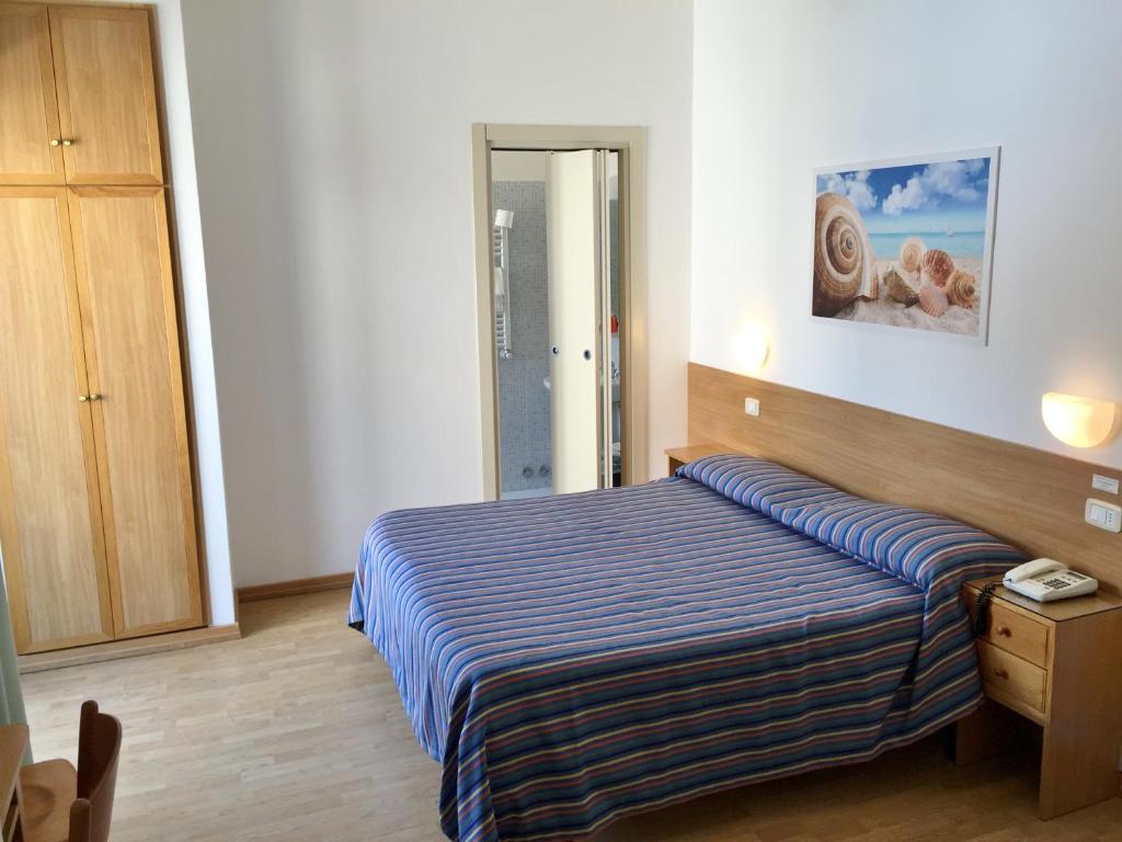 Postel nebo postele na pokoji v ubytování Hotel Mayor