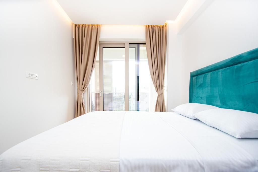 Postel nebo postele na pokoji v ubytování Aura Tower Aparments by In Property