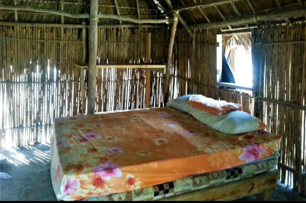 Postel nebo postele na pokoji v ubytování Islas de San blas cabaña tradicional Guna