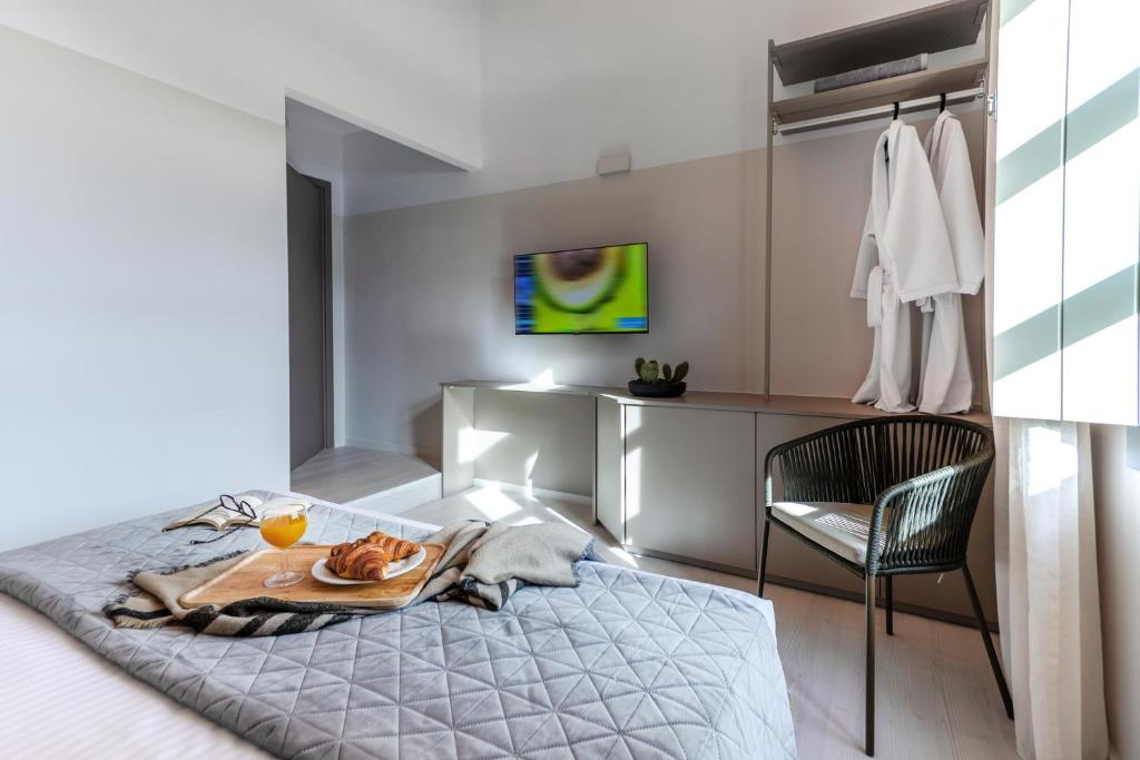 Postel nebo postele na pokoji v ubytování Octavia Rooms