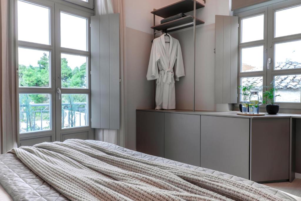 Postel nebo postele na pokoji v ubytování Octavia Rooms