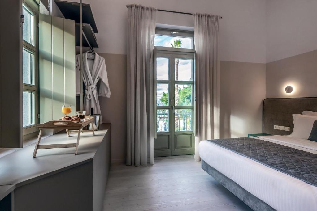 Postel nebo postele na pokoji v ubytování Octavia Rooms