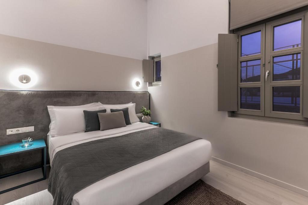 Postel nebo postele na pokoji v ubytování Octavia Rooms
