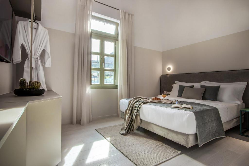 Postel nebo postele na pokoji v ubytování Octavia Rooms
