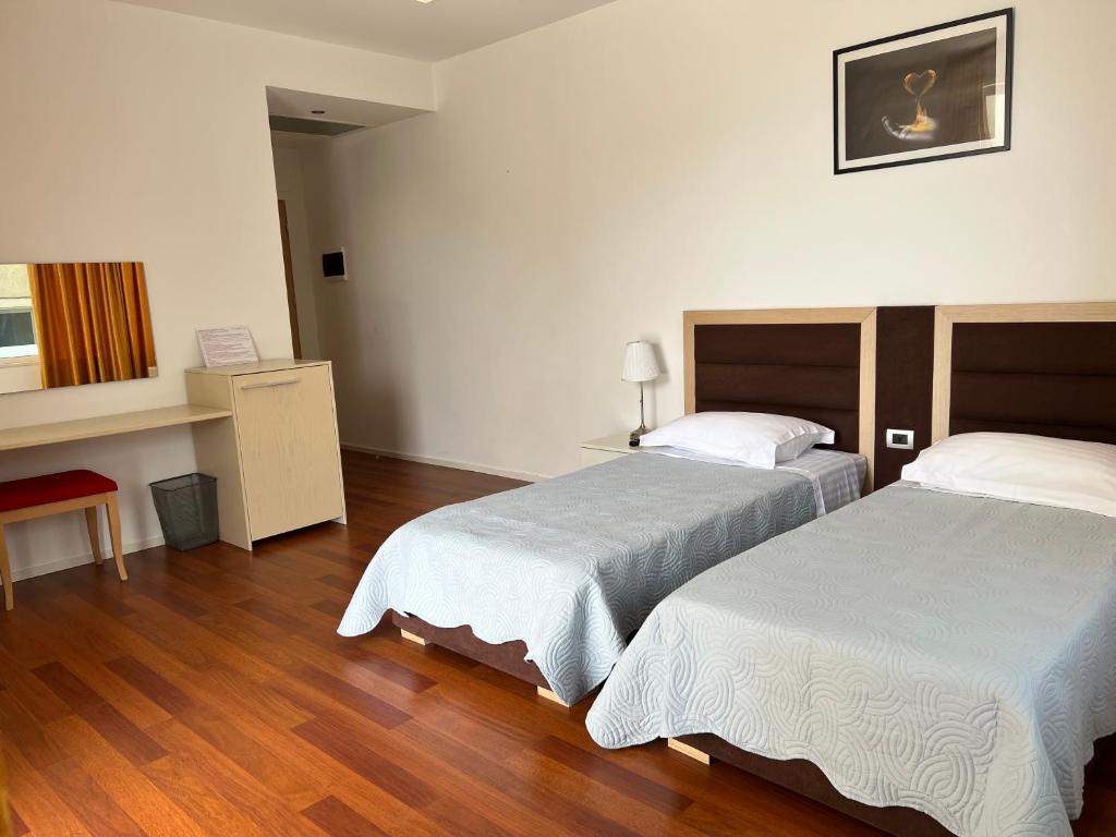Postel nebo postele na pokoji v ubytování 3B Suites Boutique Hotel