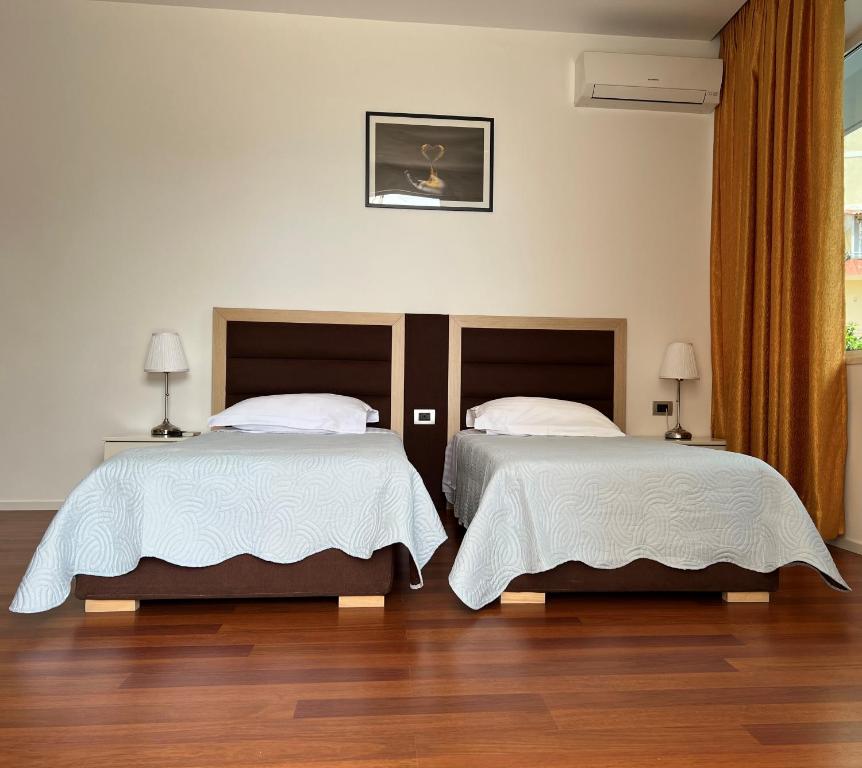 Postel nebo postele na pokoji v ubytování 3B Suites Boutique Hotel
