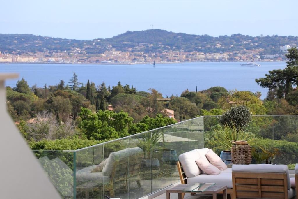 a balcony with a view of a body of water at Grimaud villa in Grimaud