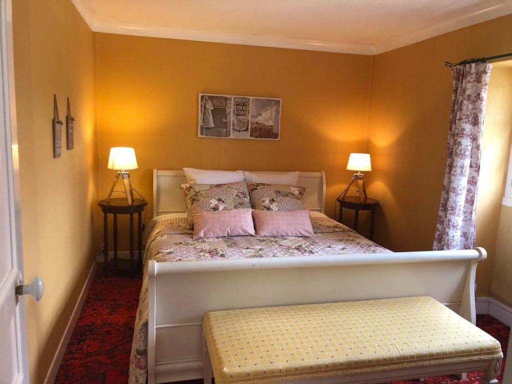 Ein Bett oder Betten in einem Zimmer der Unterkunft Le Domaine du Moulin Foulon