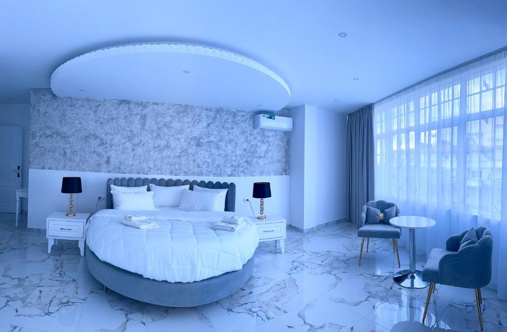 Posteľ alebo postele v izbe v ubytovaní UJVARA HOTEL