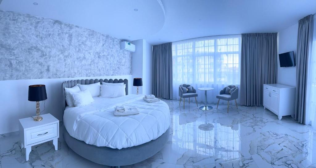 Posteľ alebo postele v izbe v ubytovaní UJVARA HOTEL