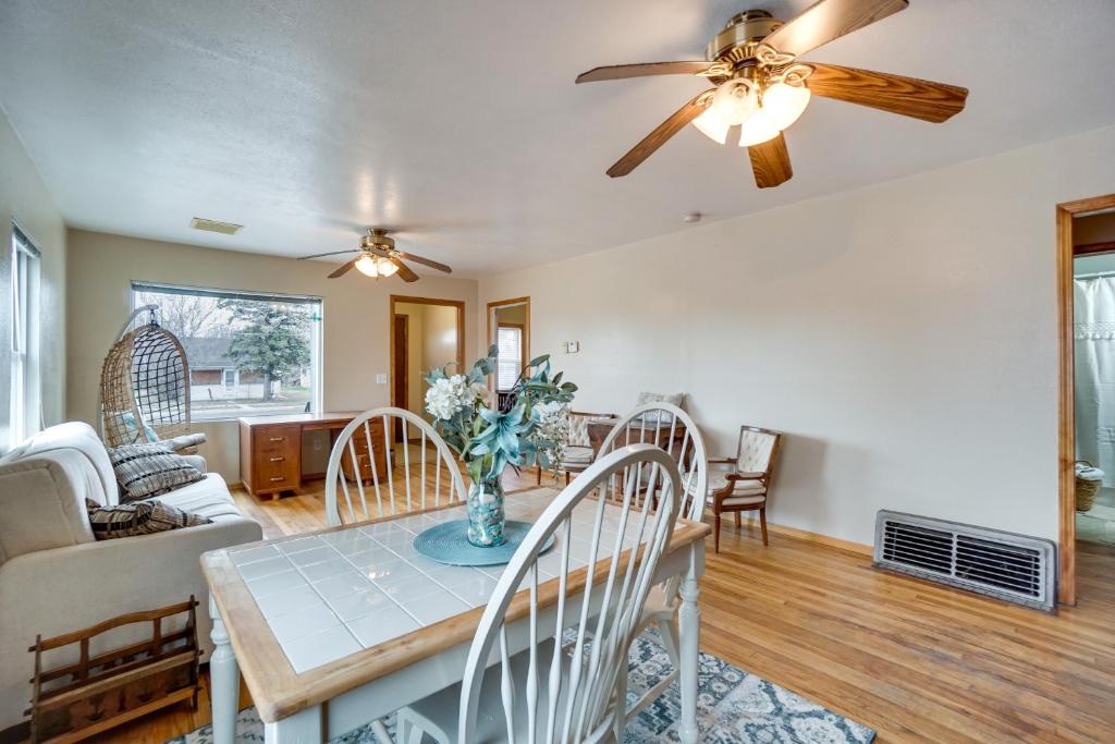 a dining room and living room with a ceiling fan at Pet-Friendly Torrington Vacation Rental Near River in Torrington