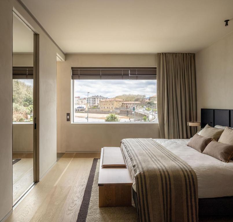 Postel nebo postele na pokoji v ubytování Hotel Ur Bare