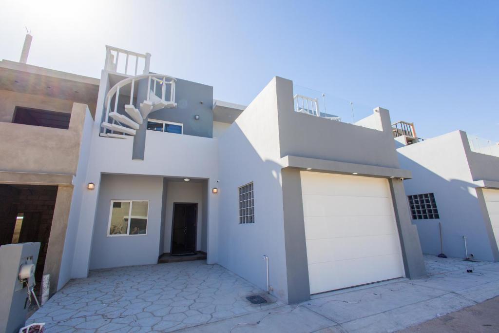a white house with a white garage at Residence 4 in Puerto Peñasco