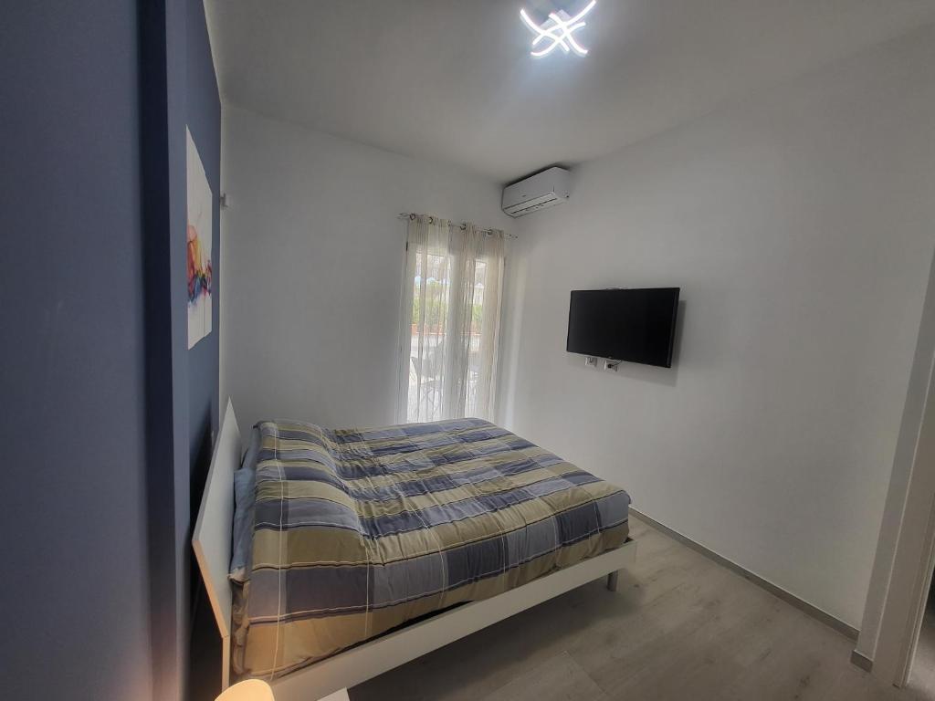Łóżko lub łóżka w pokoju w obiekcie Casa sul Mare Formia Con una Splendida Terrazza